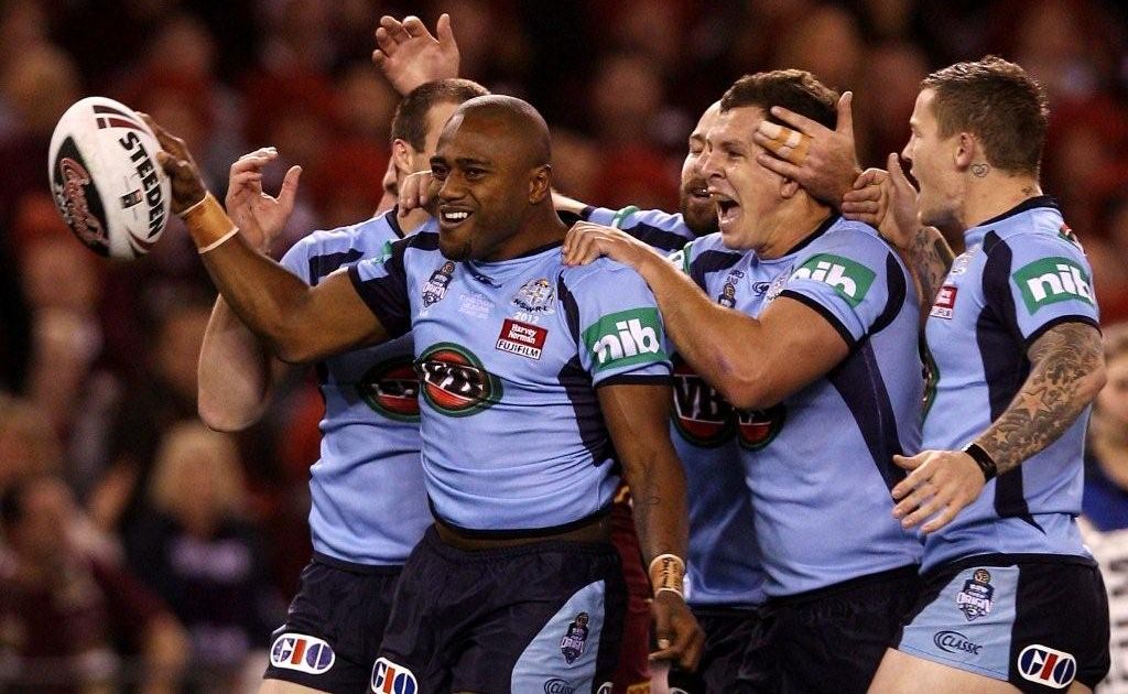 The NSW Blues players celebrate after scoring the opening try in State of Origin I. The NSW Blues players celebrate after scoring the opening try in State of Origin I.