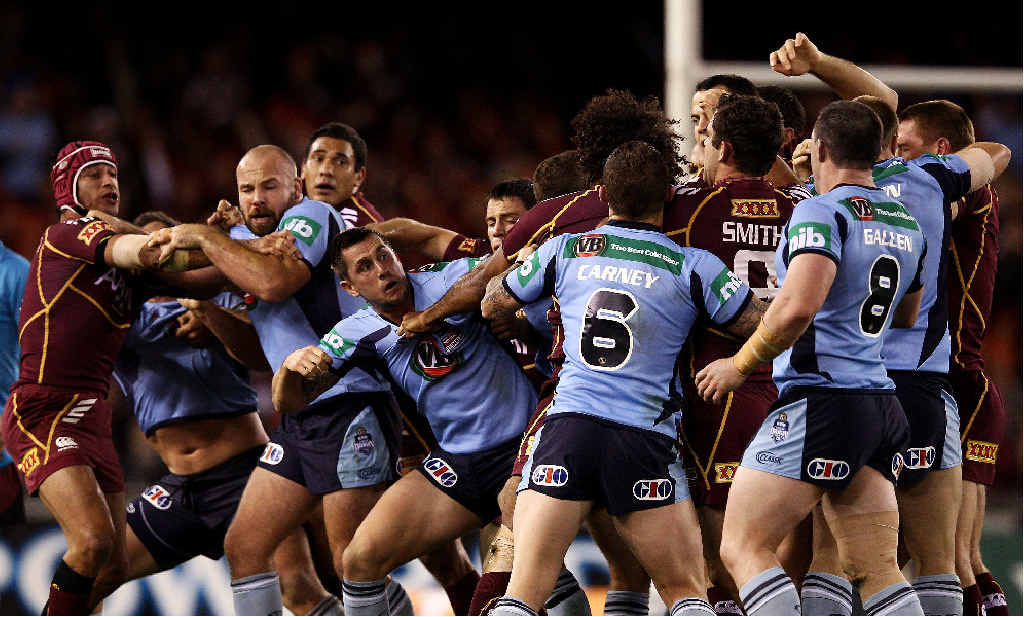 Blues and Maroons players fight during game one of the State of Origin series at Etihad Stadium in Melbourne last night. Blues and Maroons players fight during game one of the State of Origin series at Etihad Stadium in Melbourne last night.