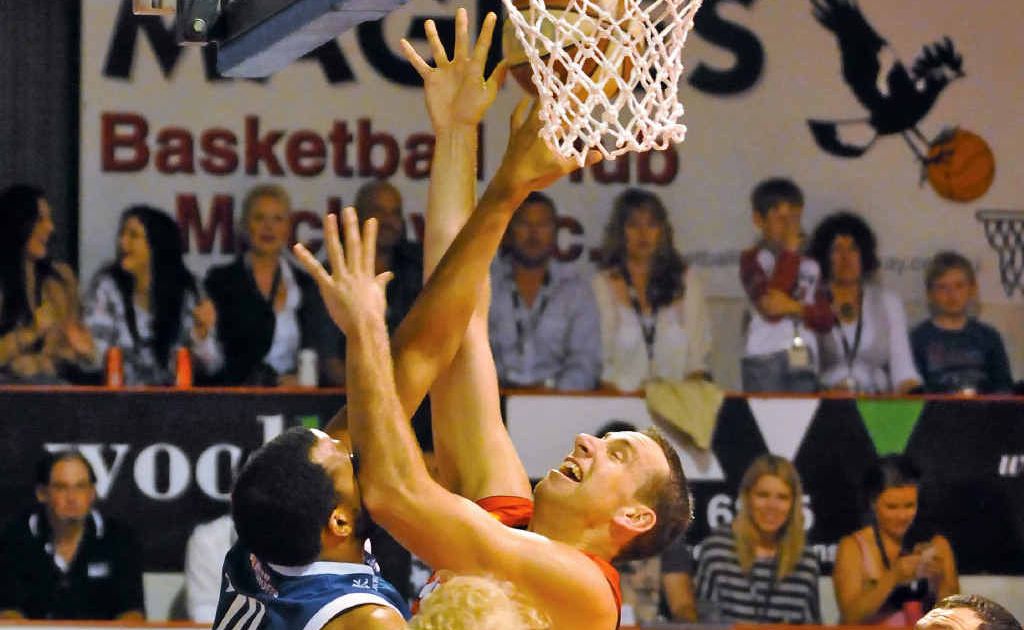 Meteors centre Greg Vanderjagt tussles for possession.
