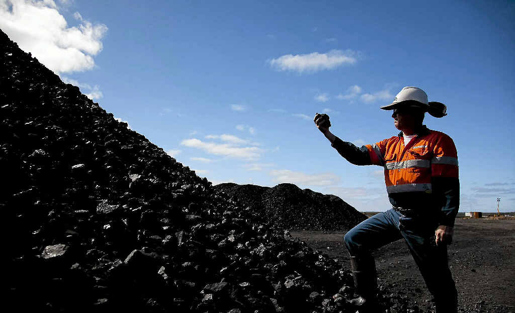 Inspecting coal from the Alpha Coal Project Test Pit where the new mine will be located. Inspecting coal from the Alpha Coal Project Test Pit where the new mine will be located.