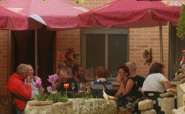 Pilgrims staying at the Boadilla del Camino albergue share a mid-afternoon drink.
Pilgrims staying at the Boadilla del Camino albergue share a mid-afternoon drink.