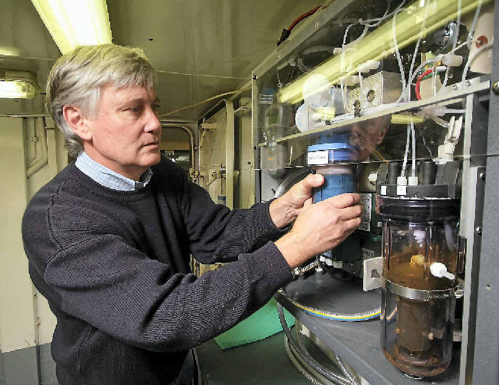 Dr Bronte Tilbrook checks shipboard equipment that samples the ocean surface. Dr Bronte Tilbrook checks shipboard equipment that samples the ocean surface.