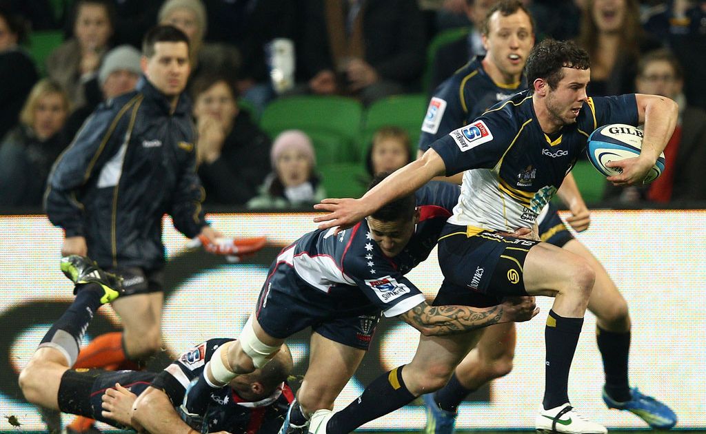 Jesse Mogg of the Brumbies is tackled by Richard Kingi of the Rebels during the round 15 Super Rugby match between the Rebels and the Brumbies at AAMI Park Jesse Mogg of the Brumbies is tackled by Richard Kingi of the Rebels during the round 15 Super Rugby match between the Rebels and the Brumbies at AAMI Park