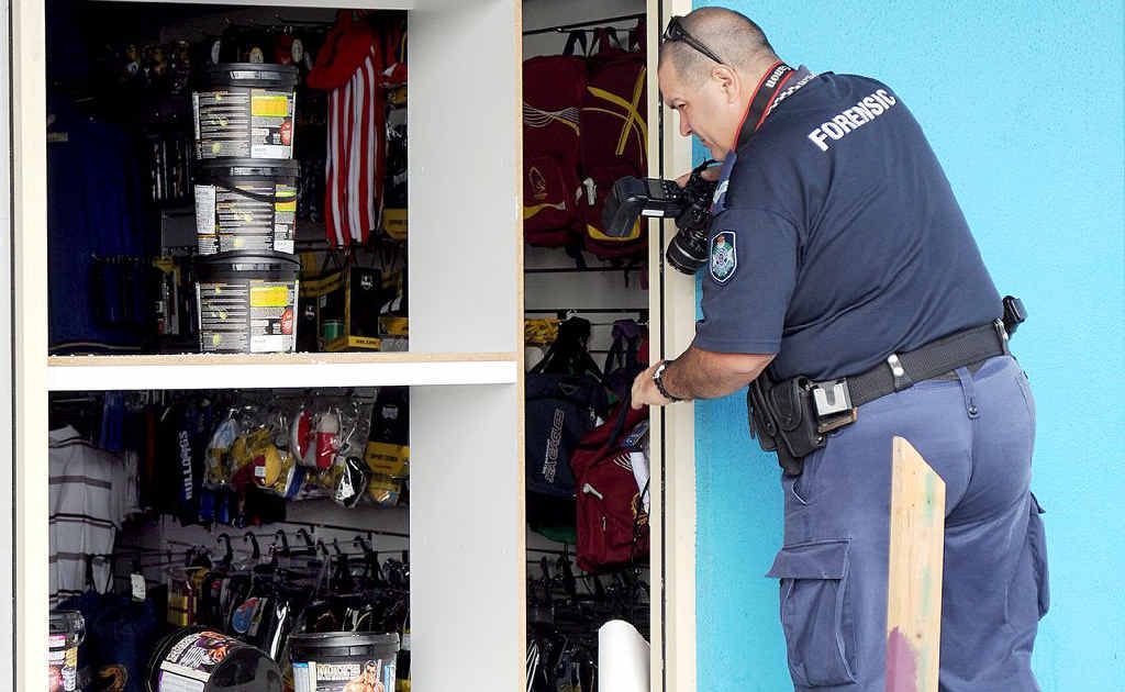 Forensic police inspected the damage at Hervey Bay's Sport First store after police interrupted the thieves early Saturday morning. Forensic police inspected the damage at Hervey Bay's Sport First store after police interrupted the thieves early Saturday morning.