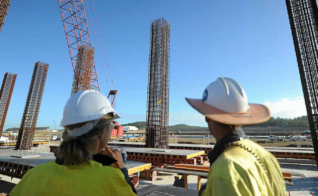 Workers look out over the Curtis Island project. Workers look out over the Curtis Island project.