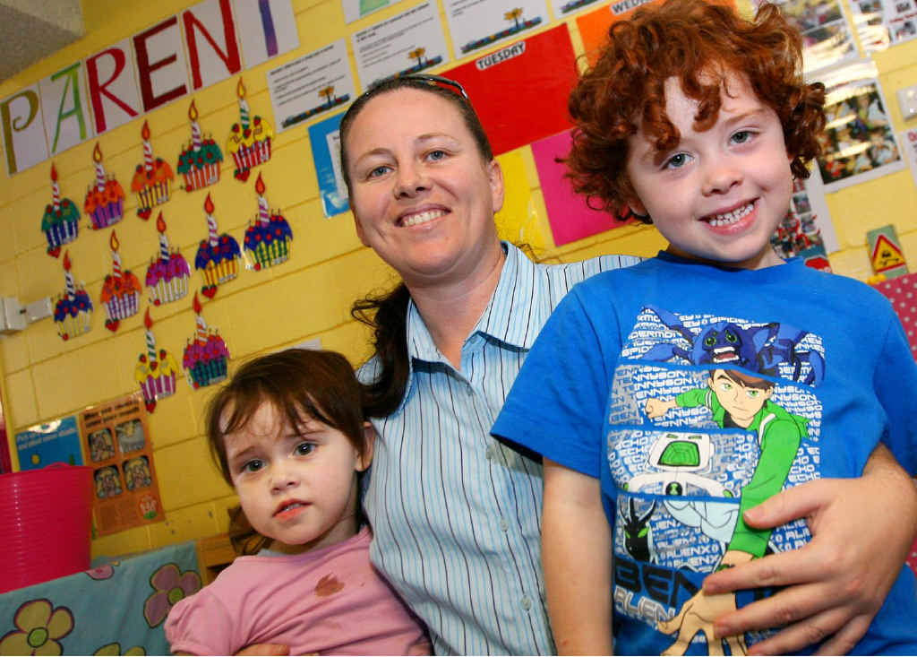 Fran Jaeger with her children Stacey Ross-Miller and Terell Ross-Miller at the Elfin House Childcare Centre. She pays almost $500 a week for childcare, and earns more working in retail than childcare staff do.