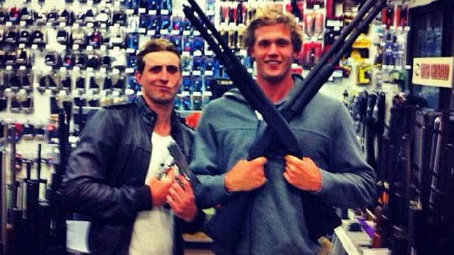 Swimming Australia ordered London Olympics team members Nick D'Arcy and Kenrick Monk to take down from Facebook and Twitter this photo with pistols and shotguns in a shop in America. Source: Facebook Swimming Australia ordered London Olympics team members Nick D'Arcy and Kenrick Monk to take down from Facebook and Twitter this photo with pistols and shotguns in a shop in America. Source: Facebook
