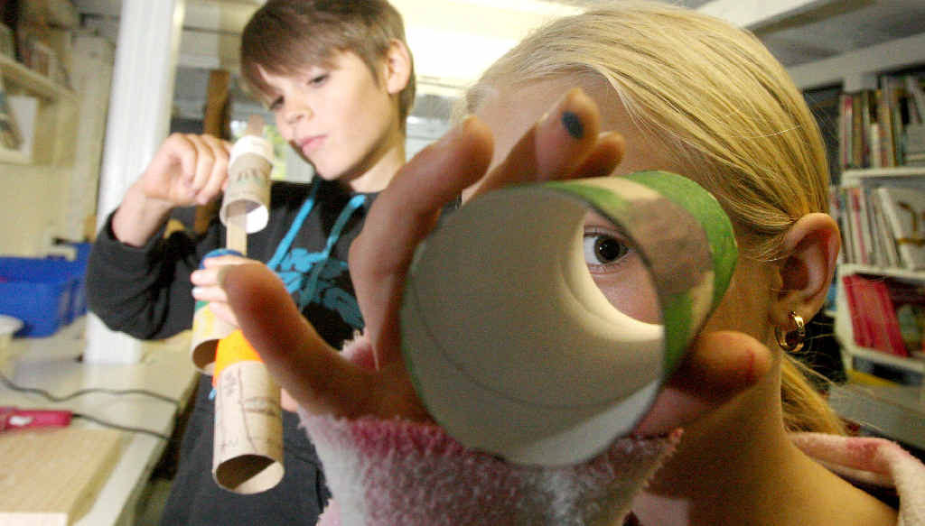 Kaiya Mcdougall (front) and Tully Dixon, use toilet rolls to make a tree for World Environment Day. Kaiya Mcdougall (front) and Tully Dixon, use toilet rolls to make a tree for World Environment Day.