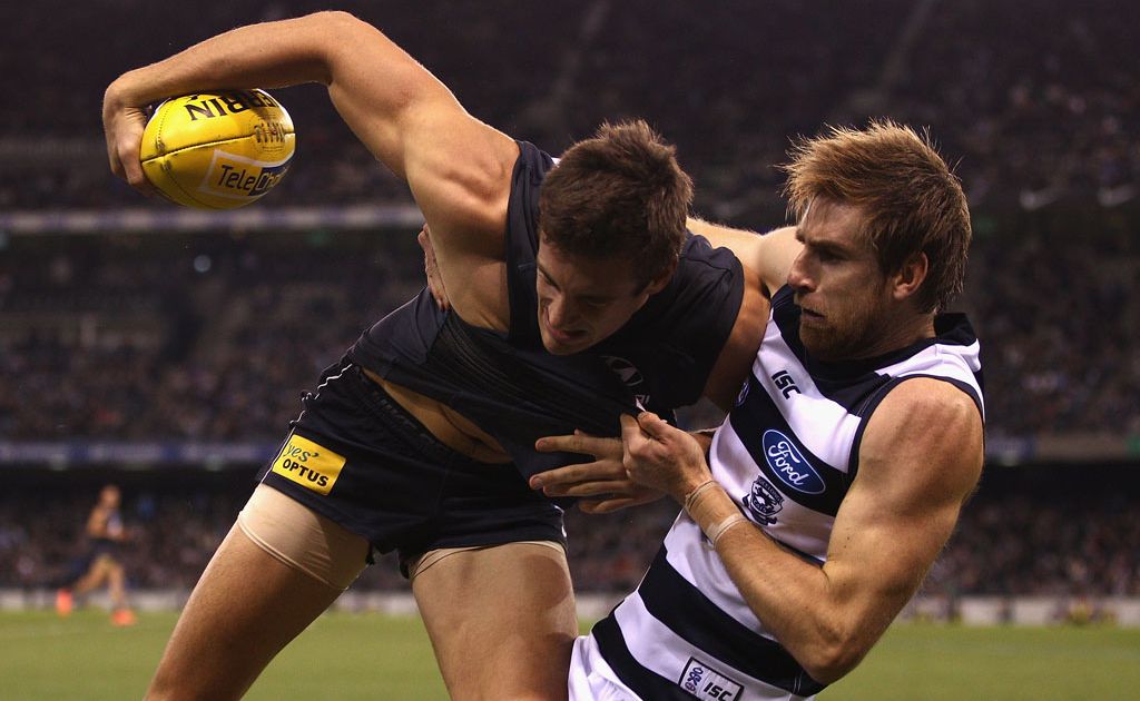 Tom Lonergan of the Cats tackles Shaun Hampson of the Blues during the round 11 AFL match between the Carlton Blues and the Geelong Cats at Etihad Stadium Tom Lonergan of the Cats tackles Shaun Hampson of the Blues during the round 11 AFL match between the Carlton Blues and the Geelong Cats at Etihad Stadium