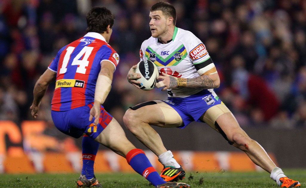 Josh Dugan of the Raiders tries to step around Chris Adams of the Knights during the round 14 NRL match between the Newcastle Knights and the Canberra Raiders at Hunter Stadium Josh Dugan of the Raiders tries to step around Chris Adams of the Knights during the round 14 NRL match between the Newcastle Knights and the Canberra Raiders at Hunter Stadium