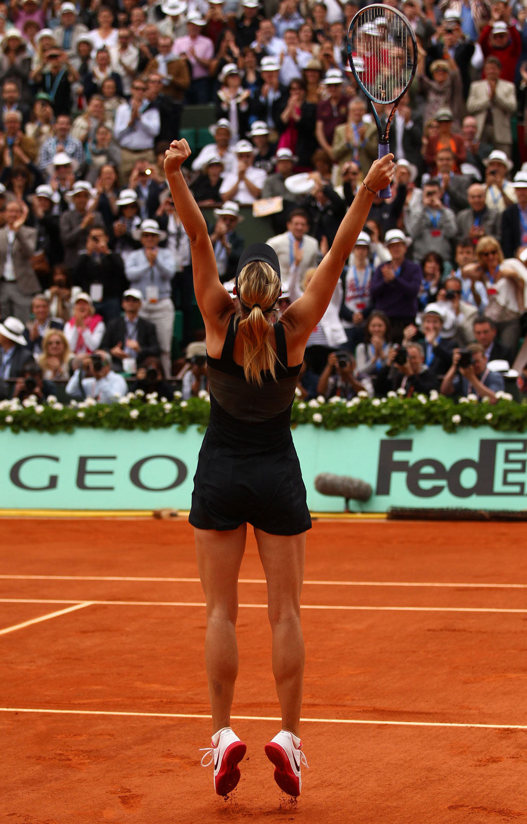 Maria Sharapova of Russia leaps in the air as she celebrates victory in the women's singles final against Sara Errani of Italy during day 14 of the French Open at Roland Garros Maria Sharapova of Russia leaps in the air as she celebrates victory in the women's singles final against Sara Errani of Italy during day 14 of the French Open at Roland Garros