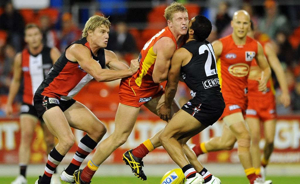 Josh Caddy of the Suns collides with Ahmed Saad of the Saints during the round 11 AFL match between the Gold Coast Suns and the St Kilda Saints at Metricon Stadium Josh Caddy of the Suns collides with Ahmed Saad of the Saints during the round 11 AFL match between the Gold Coast Suns and the St Kilda Saints at Metricon Stadium