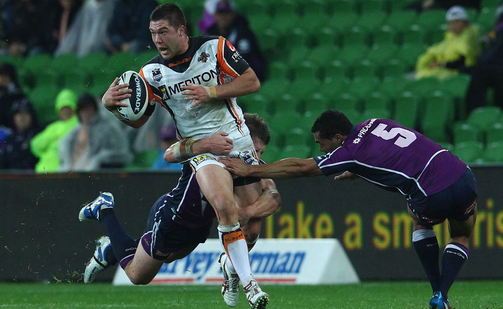 Curtis Sironen of the Tigers breaks away from his opponents during the round 14 NRL match between the Melbourne Storm and the Wests Tigers at AAMI Park Curtis Sironen of the Tigers breaks away from his opponents during the round 14 NRL match between the Melbourne Storm and the Wests Tigers at AAMI Park