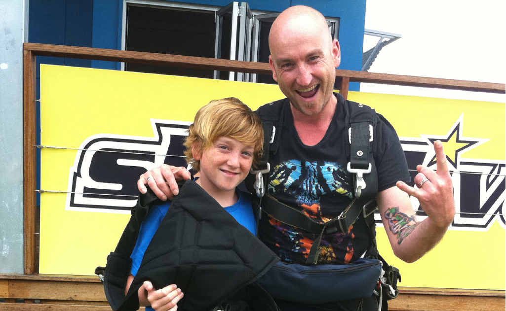 Finn Crofts, 12, with his dad Mick after a skydive. Finn Crofts, 12, with his dad Mick after a skydive.