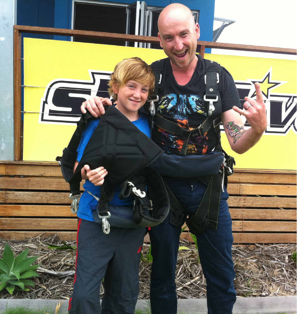 Finn Crofts, 12, with his dad Mick after a skydive. Finn Crofts, 12, with his dad Mick after a skydive.