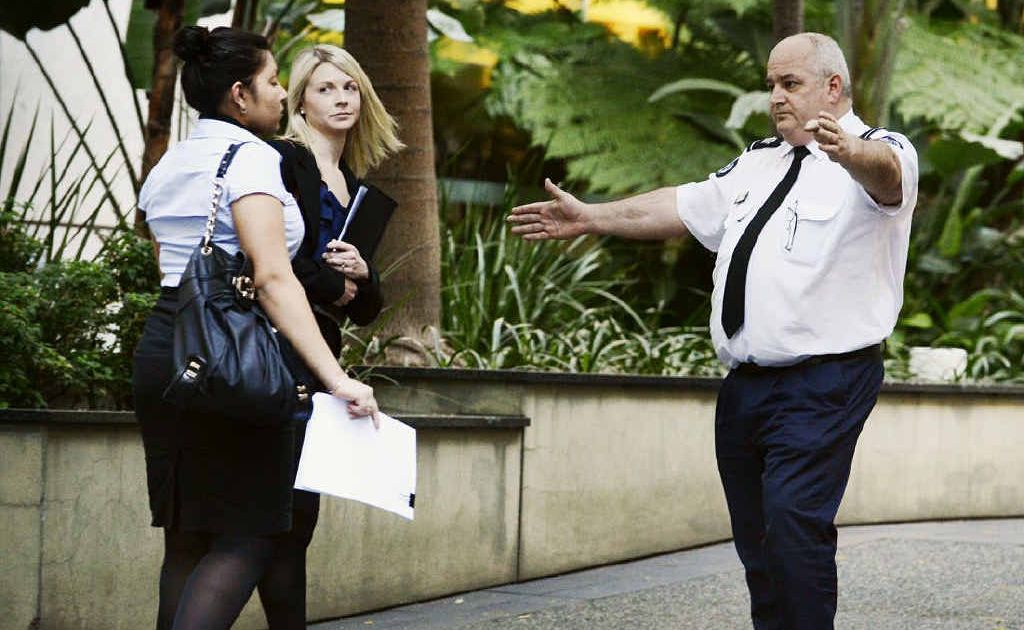 A security officer directs people away after a bomb threat interrupted the Gerard Baden-Clay court case. A security officer directs people away after a bomb threat interrupted the Gerard Baden-Clay court case.
