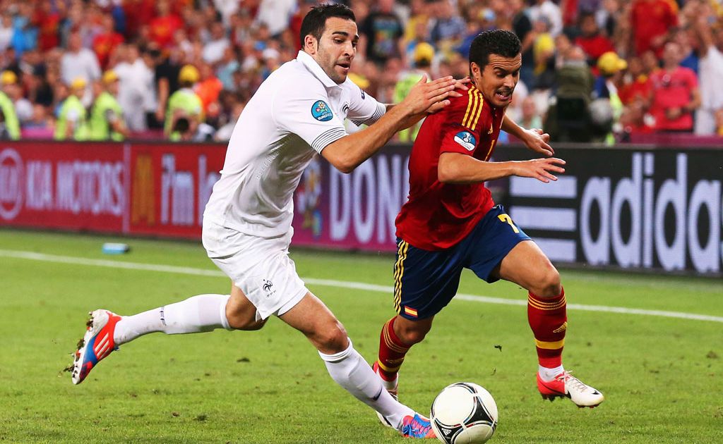 Adil Rami of France battles with Pedro of Spain during the UEFA EURO 2012 quarter final match between Spain and France at Donbass Arena in Donetsk, Ukraine. Adil Rami of France battles with Pedro of Spain during the UEFA EURO 2012 quarter final match between Spain and France at Donbass Arena in Donetsk, Ukraine.