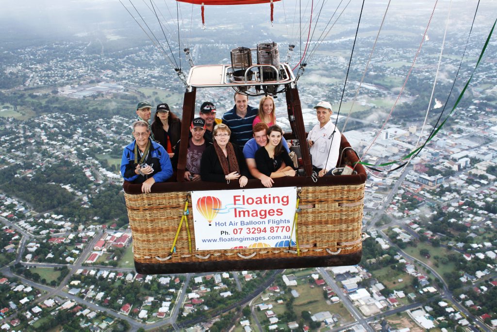 Floating Image passengers with Chief Pilot and Owner Graeme Day (right) over Ipswich City. 