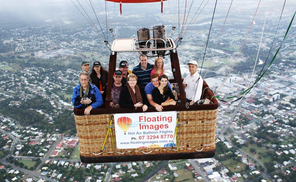 Floating Image passengers with Chief Pilot and Owner Graeme Day (right) over Ipswich City. Floating Image passengers with Chief Pilot and Owner Graeme Day (right) over Ipswich City.