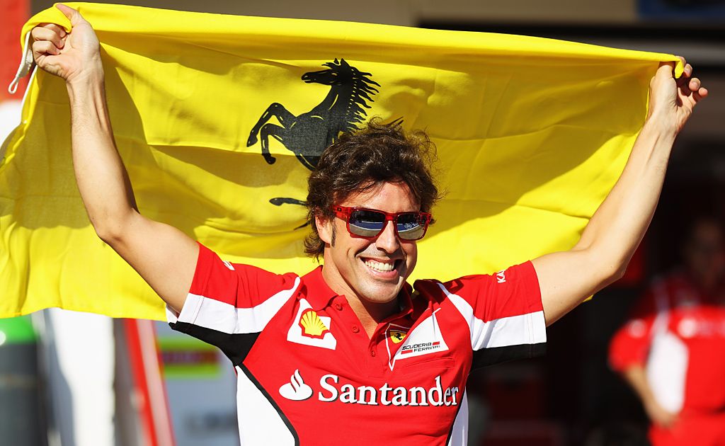 Fernando Alonso of Spain and Ferrari celebrates with team-mates in the paddock following his victory in the European Grand Prix at the Valencia Street Circuit on June 24, 2012 in Valencia, Spain. Fernando Alonso of Spain and Ferrari celebrates with team-mates in the paddock following his victory in the European Grand Prix at the Valencia Street Circuit on June 24, 2012 in Valencia, Spain.