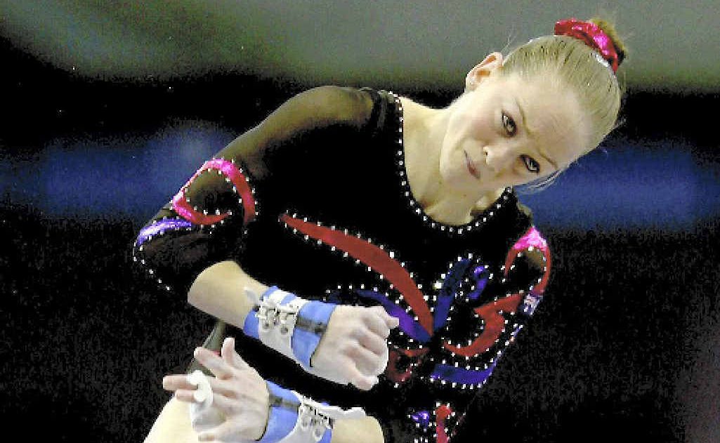 Gymnast Larrissa Miller, in action on the uneven bars, started her career in Moranbah. Gymnast Larrissa Miller, in action on the uneven bars, started her career in Moranbah.