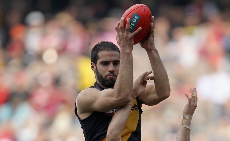 Bachar Houli of the Tigers marks ove Ben McGlynn of the Swans during the round 21 AFL match between the Richmond Tigers and the Sydney Swans at Melbourne Cricket Ground on August 14, 2011 in Melbourne, Australia. Bachar Houli of the Tigers marks ove Ben McGlynn of the Swans during the round 21 AFL match between the Richmond Tigers and the Sydney Swans at Melbourne Cricket Ground on August 14, 2011 in Melbourne, Australia.