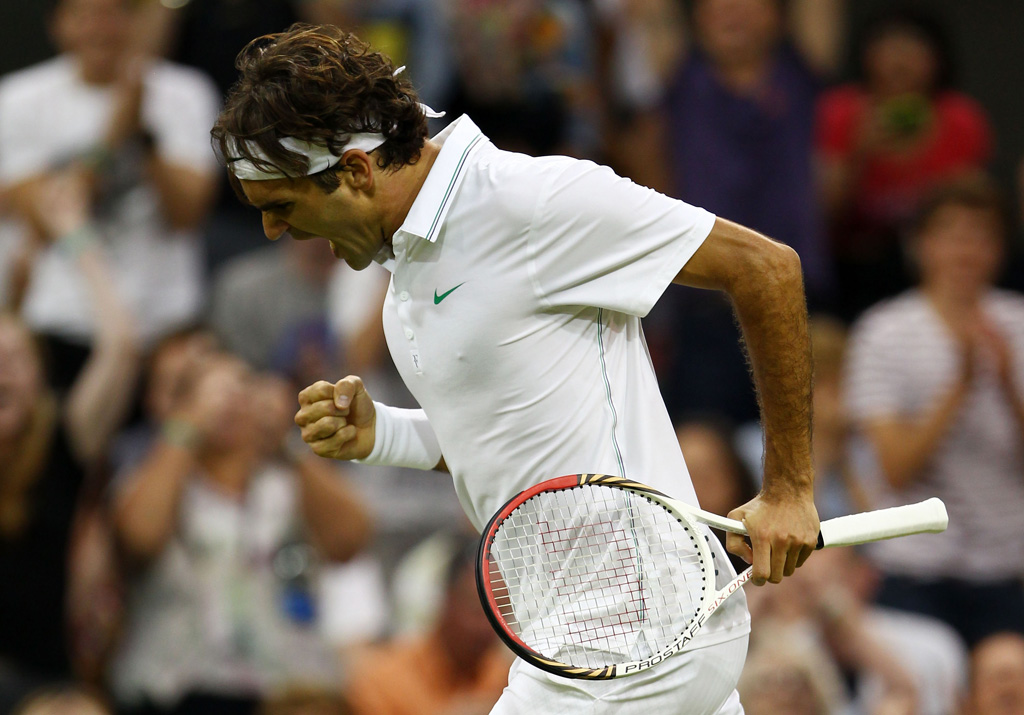 Roger Federer of Switzerland celebrates set point during his Gentlemen's Singles third round match against Julien Benneteau of France on day five of the Wimbledon Lawn Tennis Championships . Roger Federer of Switzerland celebrates set point during his Gentlemen's Singles third round match against Julien Benneteau of France on day five of the Wimbledon Lawn Tennis Championships .
