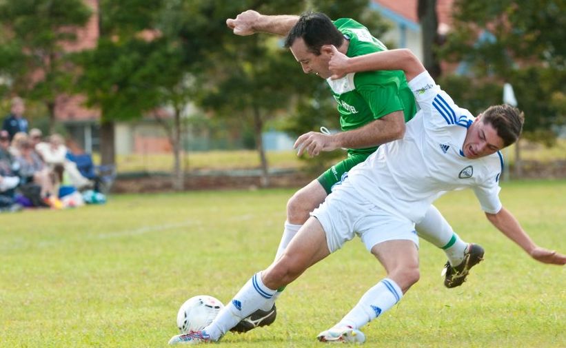 Sawtell captain Grant Martin is tackled in full flight by a Northern Storm defender. Sawtell captain Grant Martin is tackled in full flight by a Northern Storm defender.