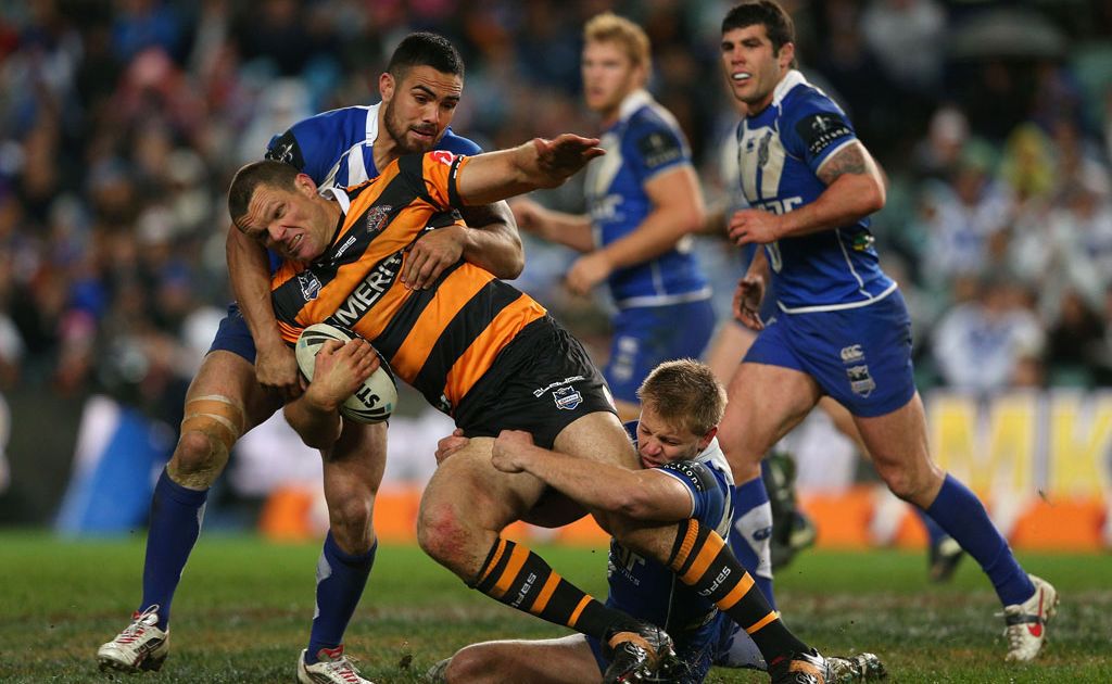 Ray Cashmere of the Tigers is tackled during the round 18 NRL match between the Wests Tigers and the Canterbury Bulldogs at Allianz Stadium Ray Cashmere of the Tigers is tackled during the round 18 NRL match between the Wests Tigers and the Canterbury Bulldogs at Allianz Stadium