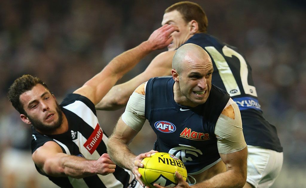 Chris Judd of the Blues breaks free of a tackle by Jarryd Blair of the Magpies during the round 15 AFL match between the Collingwood Magpies and the Carlton Blues Chris Judd of the Blues breaks free of a tackle by Jarryd Blair of the Magpies during the round 15 AFL match between the Collingwood Magpies and the Carlton Blues
