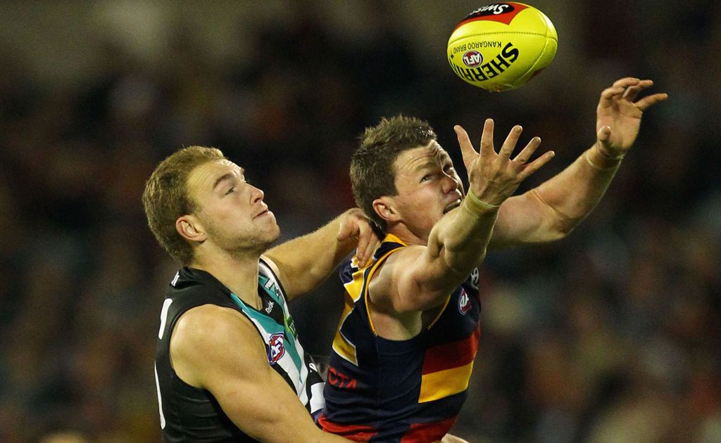 Patrick Dangerfield of the Crows marks over Andrew Moore of the Power during the round 15 AFL match between the Port Adelaide Power and the Adelaide Crows at AAMI Stadium Patrick Dangerfield of the Crows marks over Andrew Moore of the Power during the round 15 AFL match between the Port Adelaide Power and the Adelaide Crows at AAMI Stadium