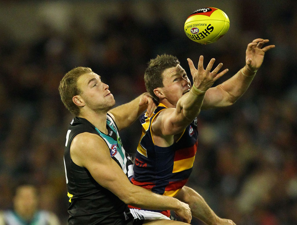Patrick Dangerfield of the Crows marks over Andrew Moore of the Power during the round 15 AFL match between the Port Adelaide Power and the Adelaide Crows at AAMI Stadium Patrick Dangerfield of the Crows marks over Andrew Moore of the Power during the round 15 AFL match between the Port Adelaide Power and the Adelaide Crows at AAMI Stadium