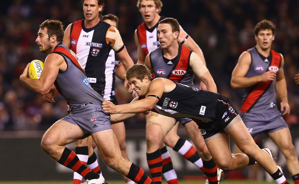 Jobe Watson of the Bombers is tackled by Nick Dal Santo of the Saints during the round 15 AFL match between the St Kilda Saints and the Essendon Bombers at Etihad Stadium Jobe Watson of the Bombers is tackled by Nick Dal Santo of the Saints during the round 15 AFL match between the St Kilda Saints and the Essendon Bombers at Etihad Stadium