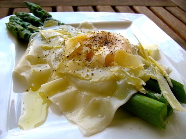 Miss Foodie's egg yolk ravioli with asparagus, truffle oil and parmesan cheese. Miss Foodie's egg yolk ravioli with asparagus, truffle oil and parmesan cheese.