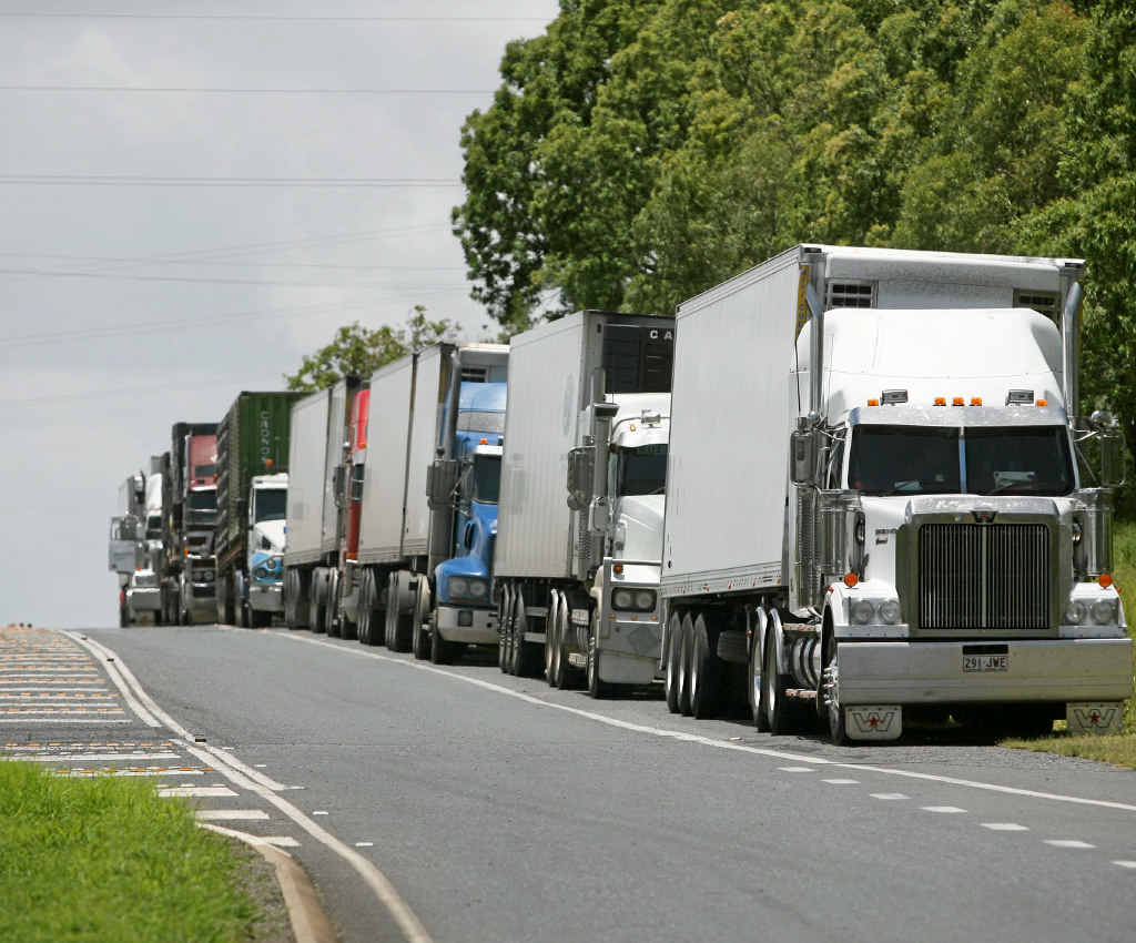 LONG WAIT: A line of trucks extends over the hill 5km from the Southern outskirts of Rockhampton waiting for the Bruce Hwy to re-open after flooding. LONG WAIT: A line of trucks extends over the hill 5km from the Southern outskirts of Rockhampton waiting for the Bruce Hwy to re-open after flooding.