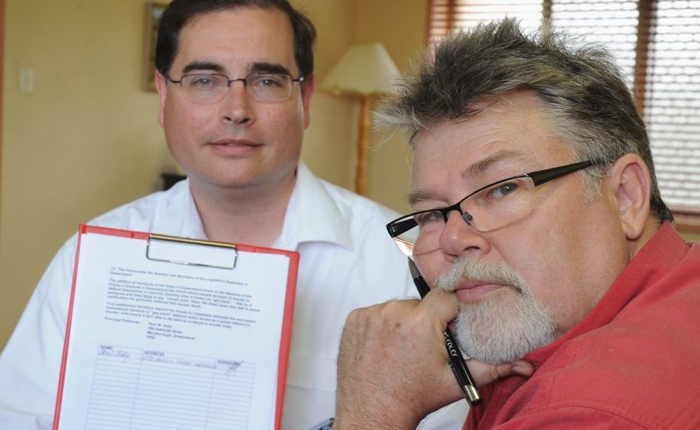 Chris Foley signs the petition floated by Paul Kelly (L) to overturn the use of the term 'gay panic' in cases against murder. Chris Foley signs the petition floated by Paul Kelly (L) to overturn the use of the term 'gay panic' in cases against murder.