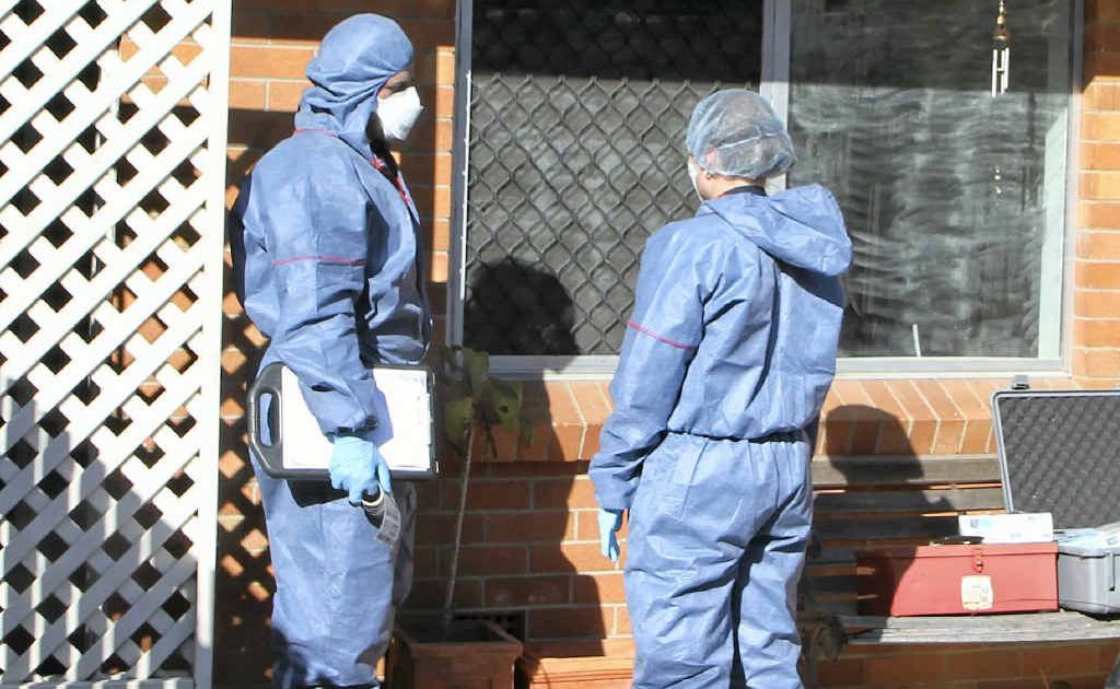 Forensic investigators inspect Mr Pullen’s Valley St unit. Forensic investigators inspect Mr Pullen’s Valley St unit.