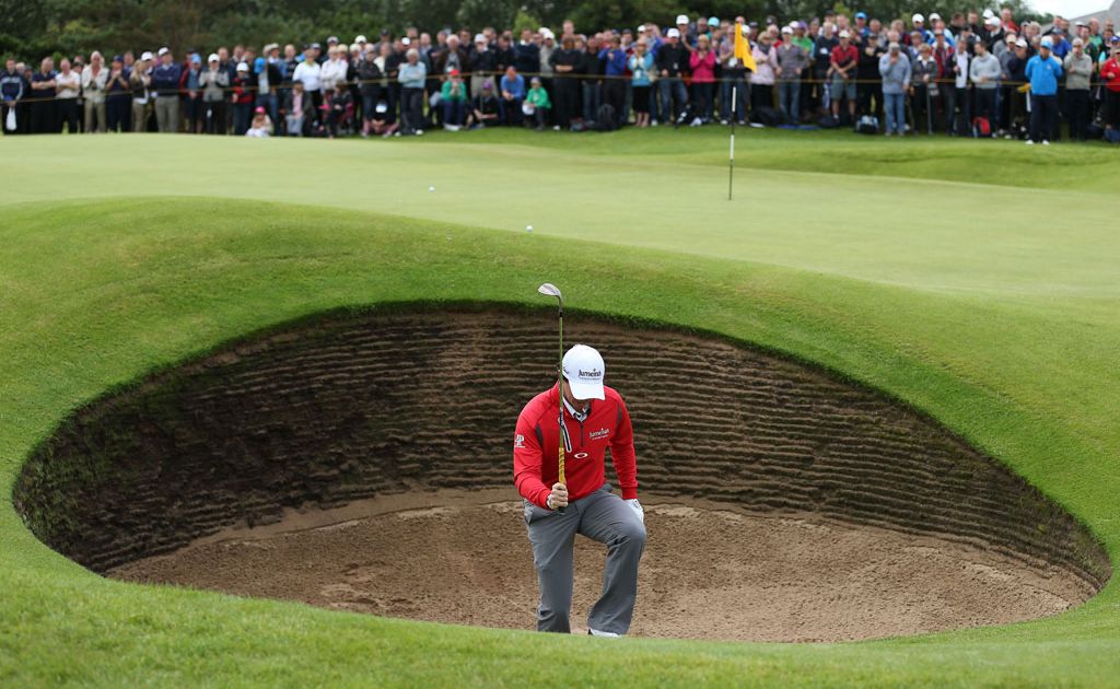 Rory McIlroy of Northern Ireland reacts to his bunker shot on the sixth hole during the second round of the 141st Open Championship at Royal Lytham & St Annes Golf Club. Rory McIlroy of Northern Ireland reacts to his bunker shot on the sixth hole during the second round of the 141st Open Championship at Royal Lytham & St Annes Golf Club.