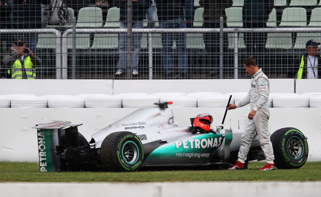 Michael Schumacher of Germany and Mercedes GP stands with his car after he span and crashed out during practice for the German Grand Prix at Hockenheimring Michael Schumacher of Germany and Mercedes GP stands with his car after he span and crashed out during practice for the German Grand Prix at Hockenheimring