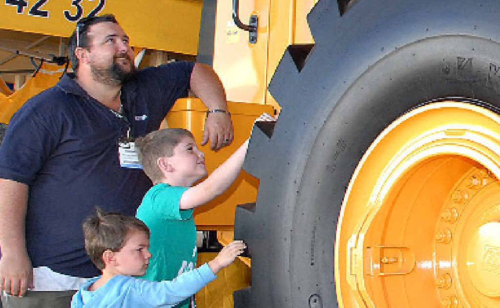 Michael Stanton, of Eimeo, and sons, Jack and Charlie, check out the heavy equipment on display at QME. Michael Stanton, of Eimeo, and sons, Jack and Charlie, check out the heavy equipment on display at QME.