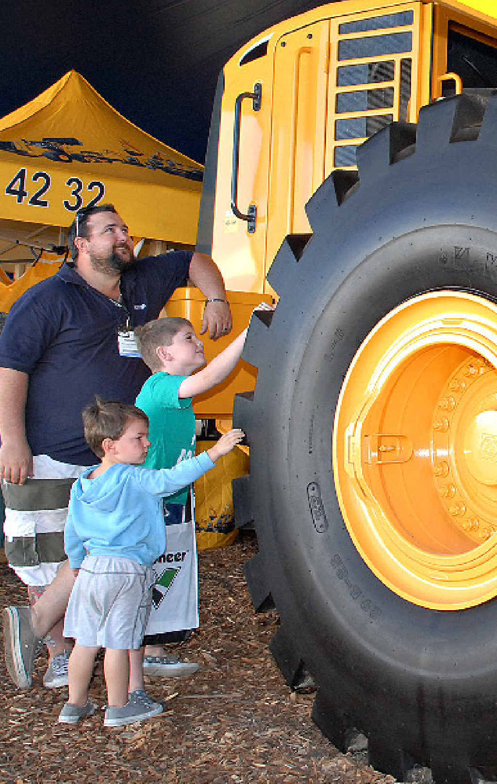 Michael Stanton, of Eimeo, and sons, Jack and Charlie, check out the heavy equipment on display at QME. Michael Stanton, of Eimeo, and sons, Jack and Charlie, check out the heavy equipment on display at QME.