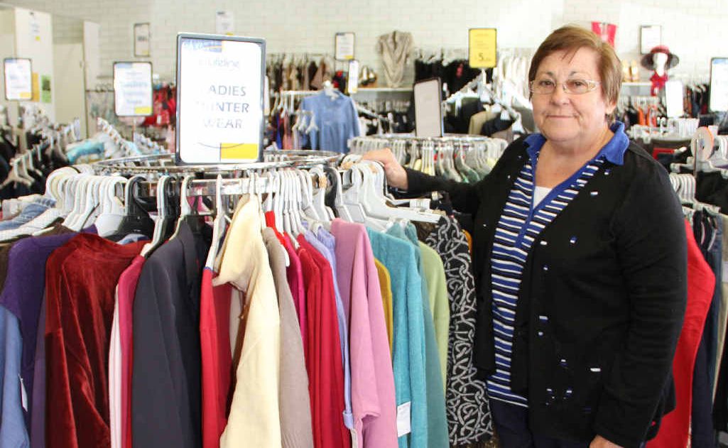 Emerald Lifeline volunteer Joan Lowery with a rack of warm coats. Emerald Lifeline volunteer Joan Lowery with a rack of warm coats.