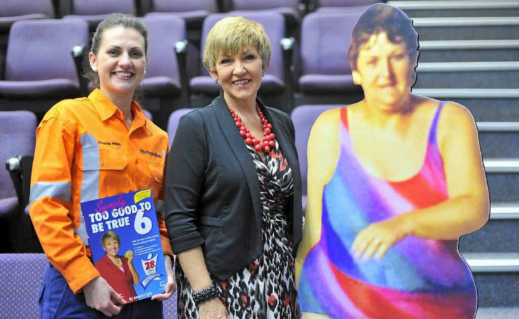 INSPIRATIONAL STORY: Rio Tinto Alcan community relations adviser Jacinta Halpin and Annette Sym next to a cut-out of Ms Sym, aged 37 and weighing 100kg. INSPIRATIONAL STORY: Rio Tinto Alcan community relations adviser Jacinta Halpin and Annette Sym next to a cut-out of Ms Sym, aged 37 and weighing 100kg.