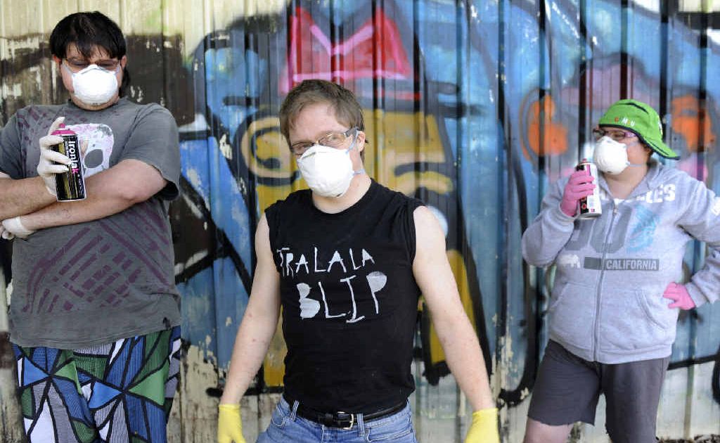 Taking their graffiti art training seriously are from left Matthew Darmond of Lismore, lydian Dunbar of Bangalow and Angela James of Goonellabah. Taking their graffiti art training seriously are from left Matthew Darmond of Lismore, lydian Dunbar of Bangalow and Angela James of Goonellabah.