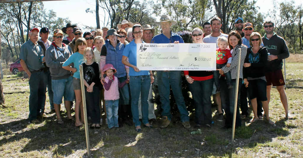 The Blair Athol Bush Sports committee and members present RACQ CQ Rescue representative Louise Blines with a $10,000 cheque at its Christmas in July party on Sunday. The Blair Athol Bush Sports committee and members present RACQ CQ Rescue representative Louise Blines with a $10,000 cheque at its Christmas in July party on Sunday.