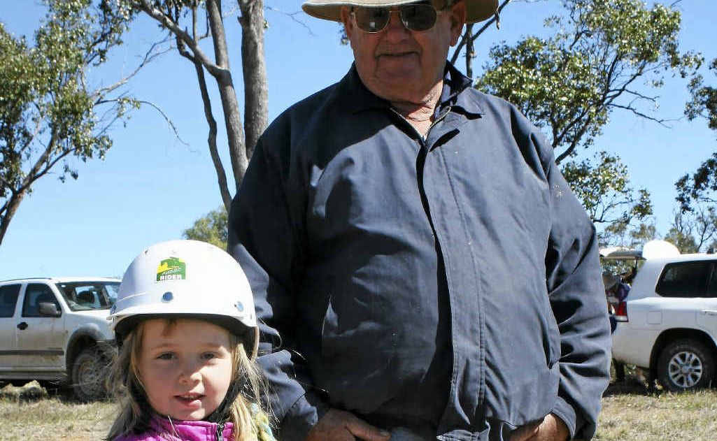 Taylor Martlem with her grandfather, Ian, and (inset) Longreach takes a run at the carnival. Taylor Martlem with her grandfather, Ian, and (inset) Longreach takes a run at the carnival.