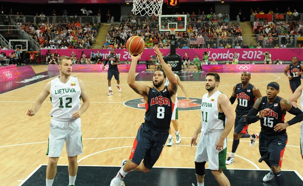 Deron Williams of the United States jumps with the ball past Antanas Kavaliauskas (L) and Linas Kleiza (2nd R) of Lithuania during the Men's Basketball Preliminary Round match between Lithuania and the United States on Day 8 of the London 2012 Olympic Games Deron Williams of the United States jumps with the ball past Antanas Kavaliauskas (L) and Linas Kleiza (2nd R) of Lithuania during the Men's Basketball Preliminary Round match between Lithuania and the United States on Day 8 of the London 2012 Olympic Games