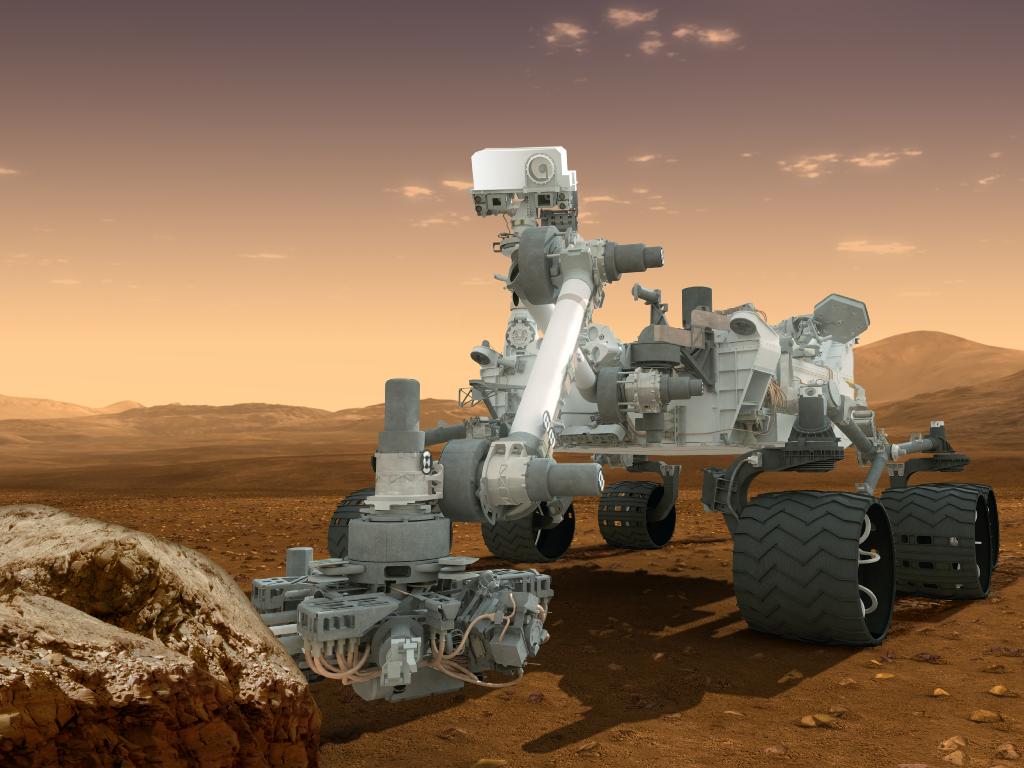 An artist's impression of "Curiosity" on Mars, assuming it isn't destroyed in a catastrophy of fire and mechano as it attempts to land. 
