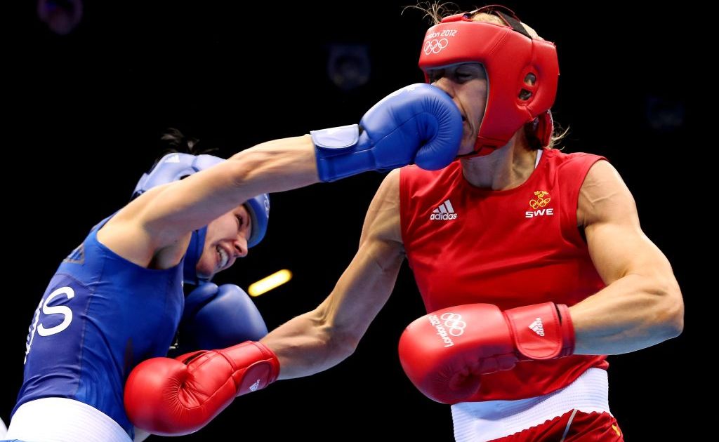 Anna Laurell of Sweden (right) in action with Naomi-Lee Fischer-Rasmussen of Australia during the Women's Middle (69-75kg) Boxing on Day 9 of the London 2012 Olympic Games at ExCeL on August 5, 2012 in London, England. Anna Laurell of Sweden (right) in action with Naomi-Lee Fischer-Rasmussen of Australia during the Women's Middle (69-75kg) Boxing on Day 9 of the London 2012 Olympic Games at ExCeL on August 5, 2012 in London, England.