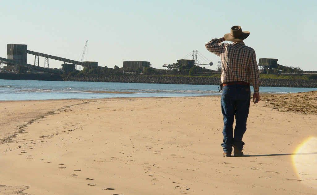 A landholder looks out at the Hay Point and Dalrymple Bay coal terminals. A landholder looks out at the Hay Point and Dalrymple Bay coal terminals.